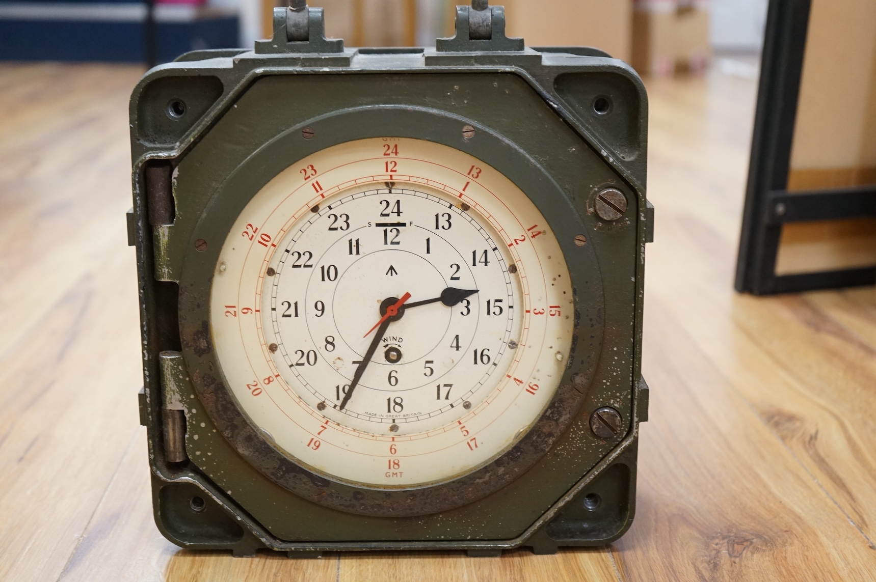 A British military Astral Smiths eight day signal clock, housed in a metal alloy case with detachable cover, 29 x 29 x 12cm